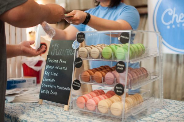 person paying for cookies at a bakery