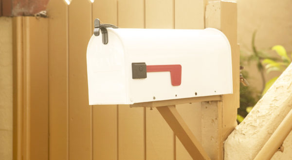 mailbox in front of a wood fence, freedom checking account, How to Switch