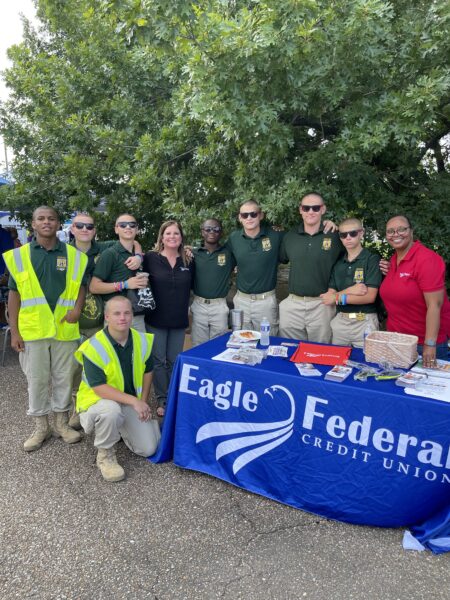 group of people at the Eagle Federal booth